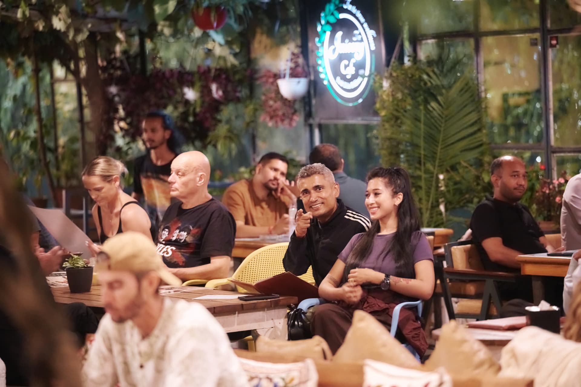 An evening social gathering at a lakeside café