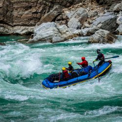 Thrilling adventure rafting through the vibrant rapids of a Nepalese river.